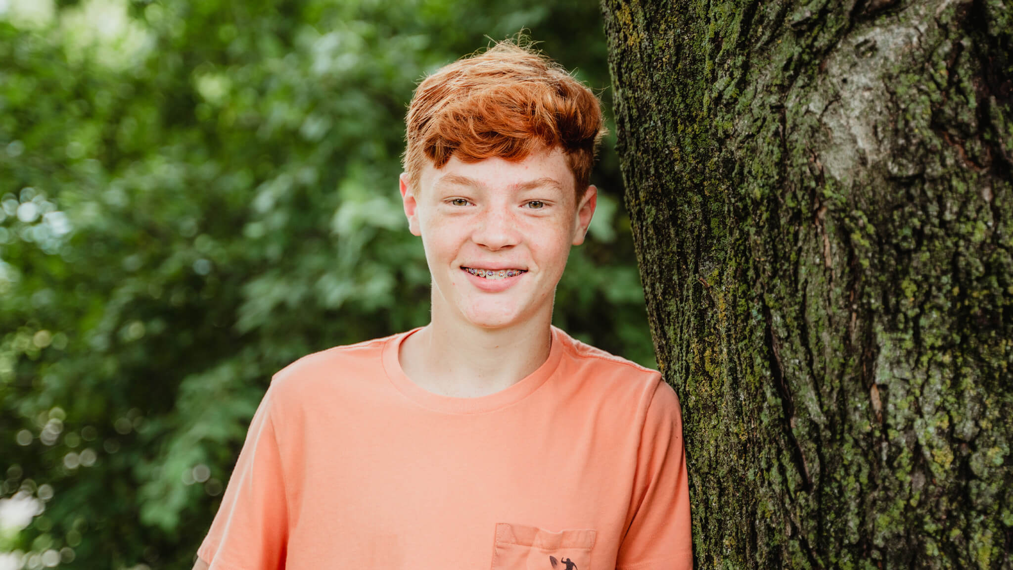 smiling teen boy with braces