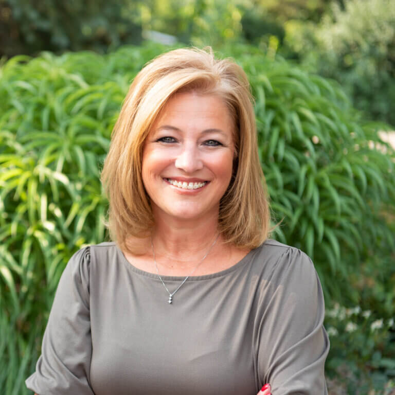 mature woman smiling outdoors